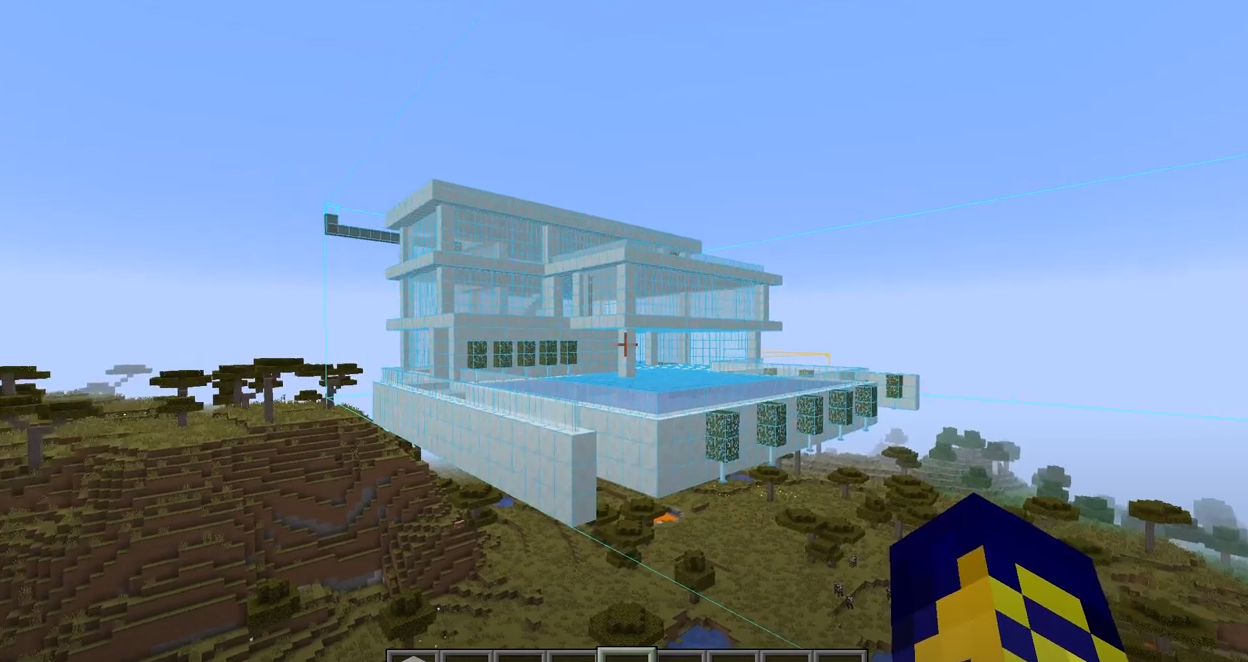 Una captura de pantalla que muestra el modo esquemático en acción, con una versión de holograma de una casa moderna en el aire