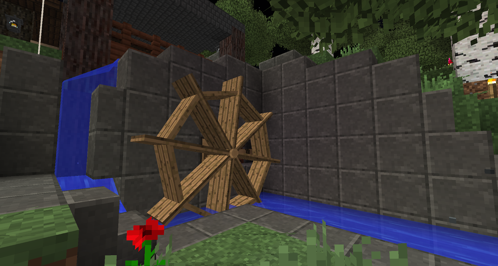 Una captura de pantalla que muestra un molino de agua de madera usado en el mod pack